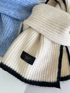 Detailed view of Japanese knit wool scarf with contrast edge, soft warm winter accessory for women.