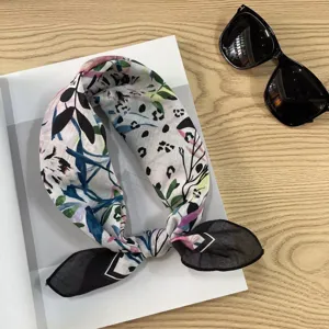 Detail shot of vintage floral printed square cotton neckerchief, stylish daily accessory.