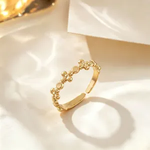 Gold adjustable stainless steel ring featuring a chic clustered bead and disc design.
