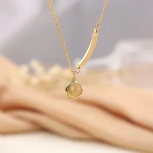 Gold titanium steel smiley face pendant necklace, fashion clavicle chain jewelry item.