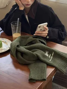 Japanese style solid color wool winter scarf with letter embroidery and cozy vibe.