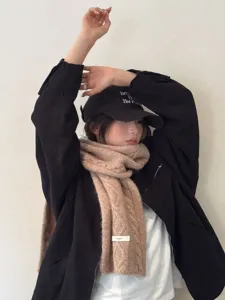 Cozy wool-blend knit scarf in solid color, featuring chunky cable knit texture detail.