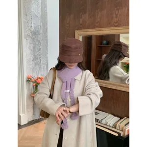 Korean style winter women's solid color braided pom-pom knitted scarf and hat set.