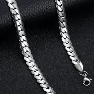 Close-up detail shot of silver titanium steel Cuban link chain necklace, polished finish.