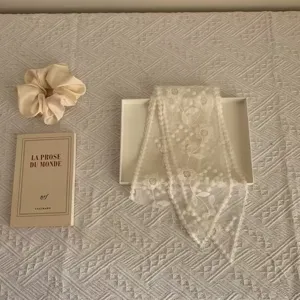 Exquisite vintage floral lace ribbon scarf, delicate embroidery detail for women chic style.
