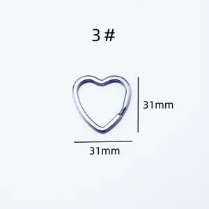 Stainless steel heart shaped key ring detail shot, durable metal hardware accessory.