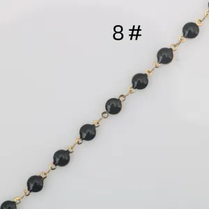 Stainless steel gold chain with black enamel beads, ideal for DIY jewelry making and crafts.
