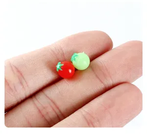 Detailed close-up view of miniature simulation tomato props for DIY play house food.