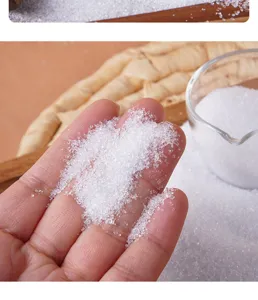 Detailed close-up of fake white sugar crystals in hand, perfect for DIY crafts and props.