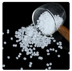Close-up detail of translucent white plastic mini rice beads for DIY slime craft.