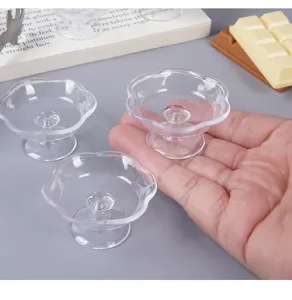 Miniature transparent tray cups, detail view of DIY dollhouse dessert food container props.