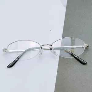 Business metal oval eyeglasses frame detail view, classic half frame optical glasses.