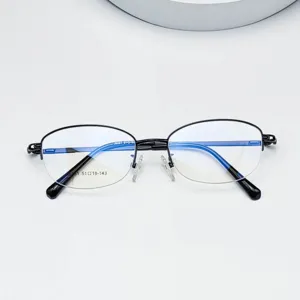 Metal half-rim oval eyeglasses frame detail showing frame structure and lens size.