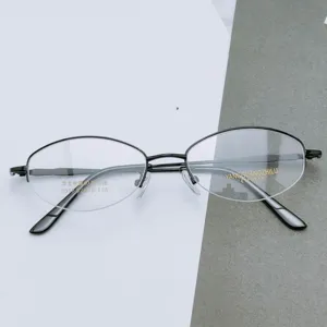 Detailed view of women's oval half-rim optical metal glasses frame in black, model 3056.