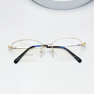 Oval metal half-rim optical glasses frame, women's lightweight prescription eyewear detail.