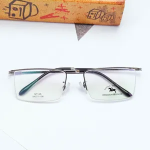 Vista dettagliata della montatura per occhiali semi-rimless in metallo spazzolato con lenti.
