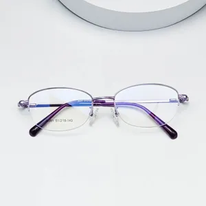 Detailed view of oval purple metal half-frame optical glasses with slim temples.