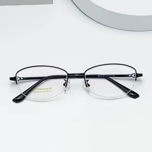 Detailed view of women's semi-rimless titanium eyeglass frames with oval shape and flexible temples.
