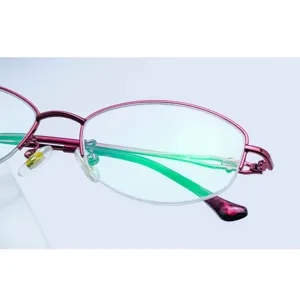 Close-up detail of women half-rim metal eyeglass frame, elegant purple finish and lens coating.
