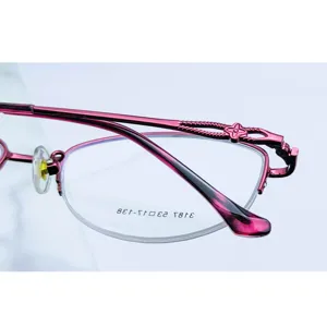 Women's metal half-frame eyeglass frame stylish optical glasses with temple flower detail.