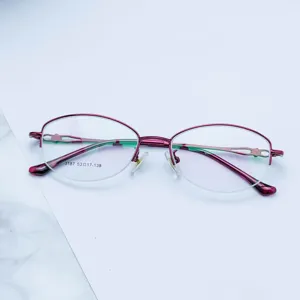 Close-up of women semi-rimless metal eyeglass frame with stylish cutout temples and clear lens specs.