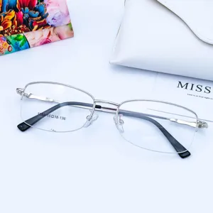 Women's half-rim metal optical glasses frame with memory temples. Clear detail view of frame.
