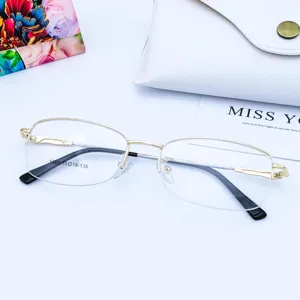 Close-up detail of women's semi-rimless metal optical glasses frame with flexible temple.