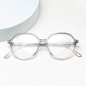 Closeup of clear grey pink gradient TR90 anti-blue light eyeglasses frame, lightweight daily wear.