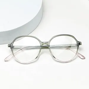 Detail view of lightweight TR90 optical glasses frame with gradient grey and pink rim design.