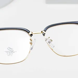 Anti-blue light glasses frame for men and women, black and gold half-rim optical eyewear.