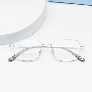 Close-up detail of silver metal square eyeglasses frame, lightweight optical eyewear.