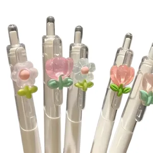 Lindo juego de bolígrafos de gel retráctiles florales con dijes de tulipanes translúcidos pasteles.
