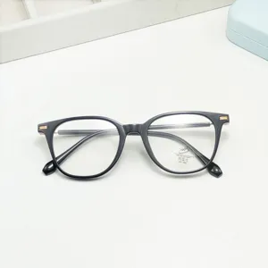Close-up detail of retro black TR anti-blue light glasses frame with metal hinge accent.