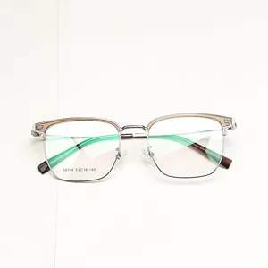Detailed view of stylish half-rim browline optical glasses frame with clear and metal design.