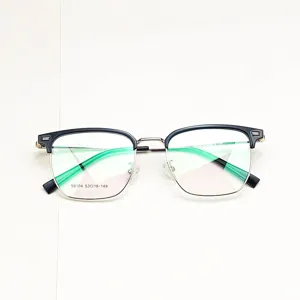 Detail view of classic semi-rimless eyeglasses frame with black browline and clear demo lenses.
