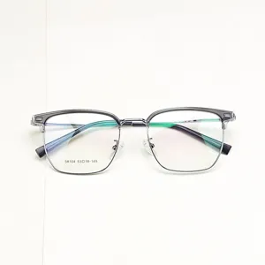 Detailed view of the stylish browline glasses frame with clear lower rim and metal upper part.