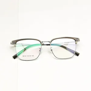 Classic half-rim browline eyeglasses frame for men and women, stylish metal and plastic design.