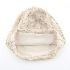 Close-up detail of lightweight breathable mesh slouchy beanie, spring summer vintage style hat.