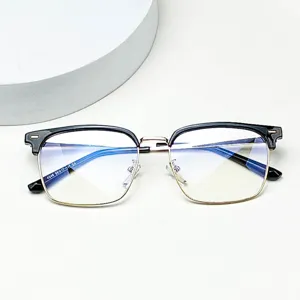 Closeup detail of the black and gold browline glasses frame, highlighting exquisite craftsmanship.