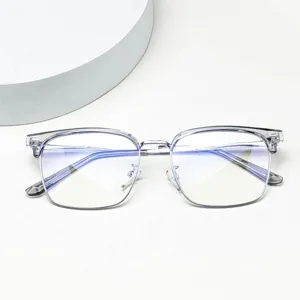 Detailed close-up of clear half-frame anti-blue light glasses showing precise temple markings and structure.