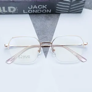Montatura per occhiali da vista poligonale semicerchiata in titanio stile retro luce blu.