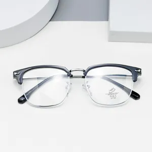 Detailed closeup view of stylish half-rim optical eyeglasses with clear anti-blue lenses.