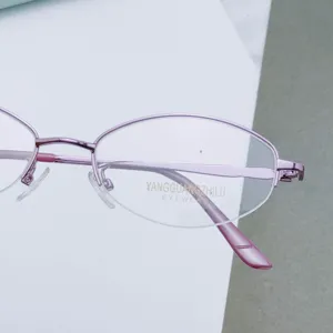 Metal semi-rimless oval women's eyeglasses frame in pink finish, main product view display.