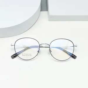 Detail view of round beta-titanium eyeglasses frame, lightweight optical glasses 50-19-143.