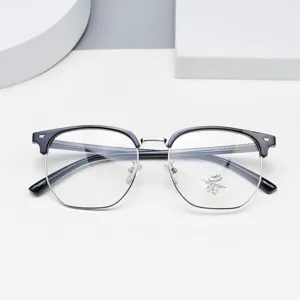 Detailed view of trendy polygon half-frame anti-blue light glasses with black and silver.