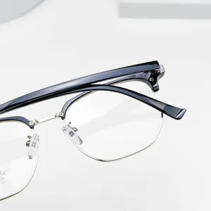 Stylish polygonal browline eyeglass frames with black acetate and silver metal rims main view.