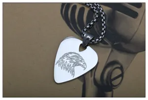 Stainless steel guitar pick pendant necklace detail featuring detailed eagle head engraving close up.