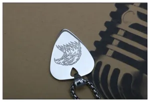 Stainless steel guitar pick pendant detail view, eagle engraving and vintage music style necklace.