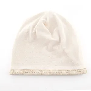 Close-up detail of the beige mesh slouchy beanie showing breathable knit texture nicely.