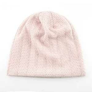 Close-up detail of the lightweight pink mesh slouchy beanie, breathable knit fabric.